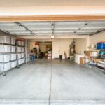 An Empty Garage Space With Plastic Bin Storage