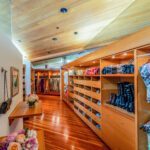 A Large Walk in Closet Space With Wood Cabinets