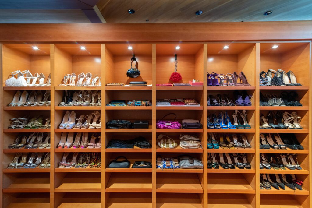Copy of Ryen photo shoot A Woman Putting a Dress on a Rack Space